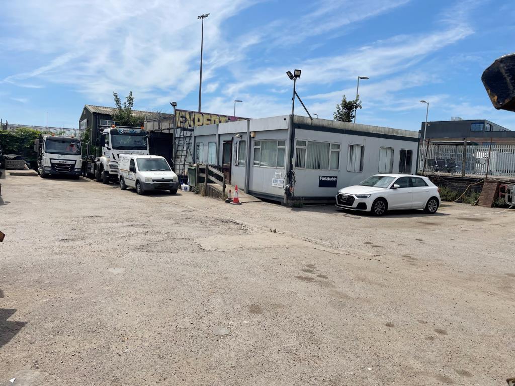 Lot: 99 - LAND WITH RESIDENTIAL PLANNING FOR 33 UNITS - Rear of site with prefab office and yard area